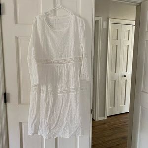 White eyelet dress. Knee length.